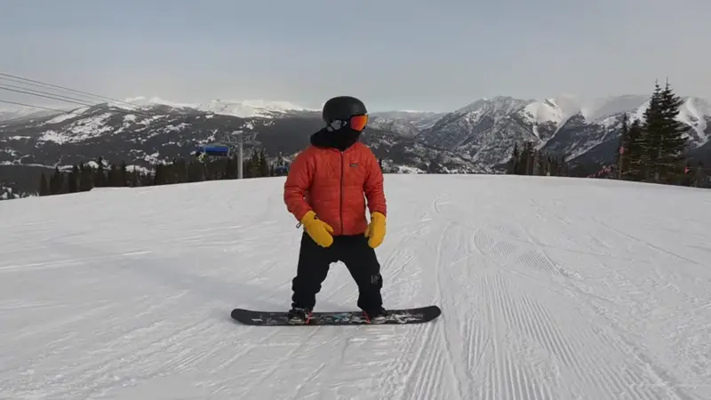 do jumps on the slope while riding