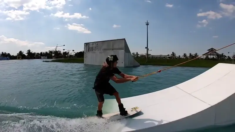land a heelside frontside 540 off the kicker